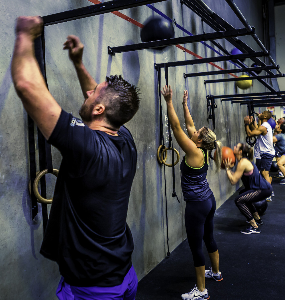 365 Performance group class doing wall balls - capped sessions with real coaching